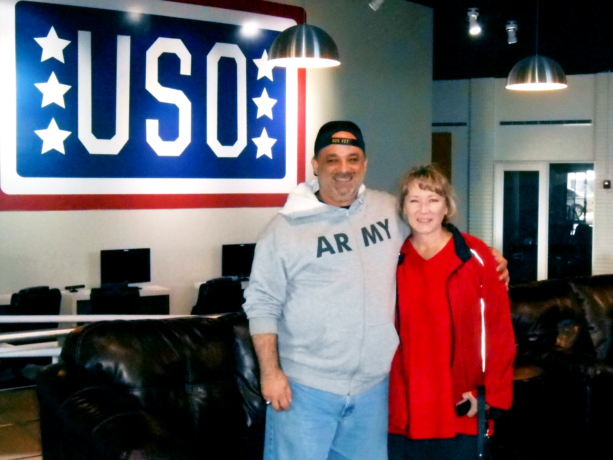 Jay and Kerri Giglio pose inside USO Fort Campbell, Ky., after driving from Texas to deliver 18 boxes of donated goods. USO Fort Campbell photo