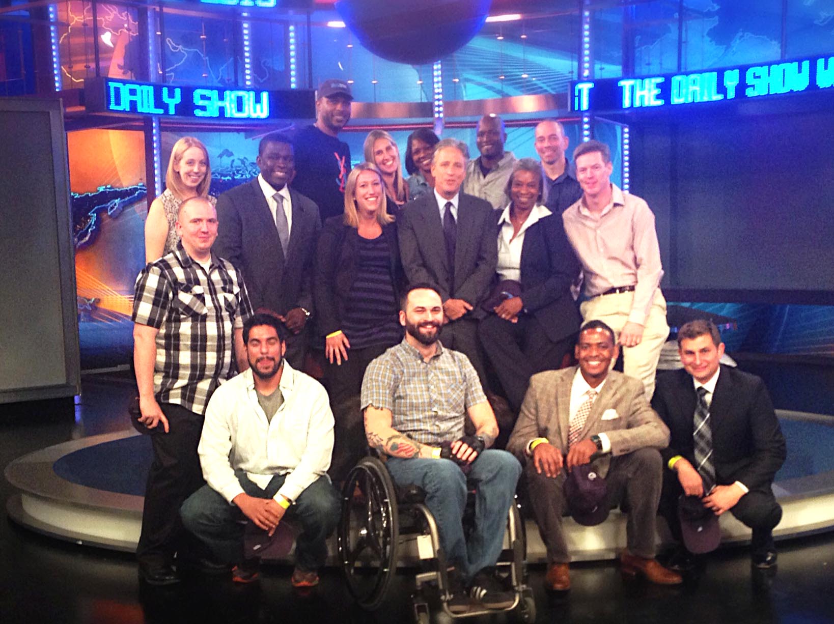 A group of wounded, ill and injured troops and their guests meet with "The Daily Show" host Jon Stewart, center, in New York City on Thursday. Stewart hosted the USO outing. USO photo