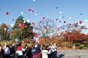 A USO/TAPS camp in Boston in 2012 ended with a balloon release. The balloons are released in remembrance of loved ones who died. USO photo by Michael A. Clifton