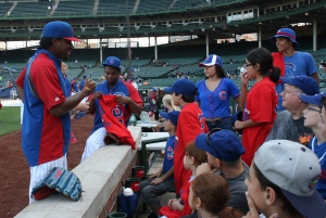 Cubs pitchers Edwin Jackson and Wesley Wright signed autographs and posed for photos with the USO group. Photo courtesy of the Chicago Cubs