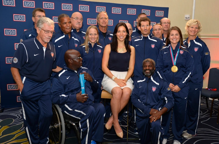2012 U.S. Olympic swimmer Kate Ziegler poses with athletes at a USO-hosted pep rally Team USA Invictus Games particpants on Friday in Herndon, Virginia. USO photo by Mike Theiler