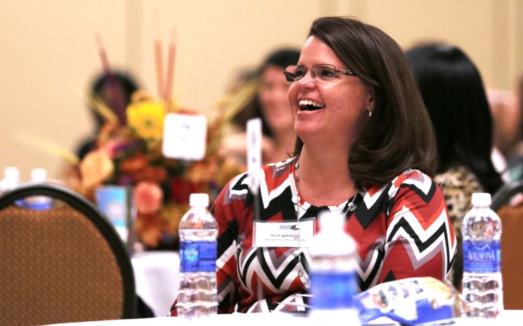 Virginia Peacock, an Elizabeth Dole Foundation Fellow, laughs during a presentation Thursday at the USO Caregivers Conference in Fayetteville, North Carolina. USO photo by Eric Brandner