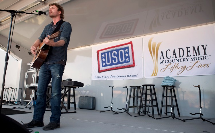 Country music artist Dierks Bentley performs during the USO/ACM Lifting Lives concert at Nellis Air Force Base in Las Vegas, NV, April 17, 2010. USO Photo by Fred Greaves