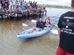 G.I. Theta Chi participants paddle a canoe at the University of Central Florida.