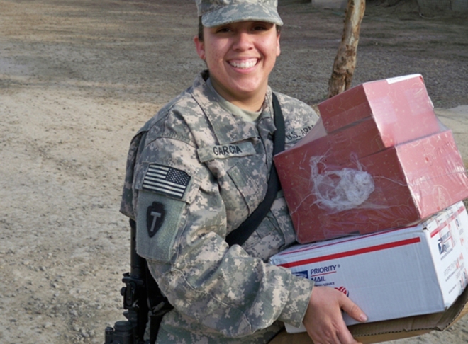 Pfc. Lucero Garcia, a native of Fort Worth, Texas, works hard and long hours as a frontline Soldier and still at the end of her shift is able to put on a smile. The mail Garcia has received today is spirit lifting and a welcomed sight from family members back home sending to their loved one. Garcia is deployed with Bravo Company, 949th Brigade Support Battalion, 10th Sustainment Brigade Troops Battalion, 10th Sustainment Brigade in support of Multi-National Division Ð Baghdad.